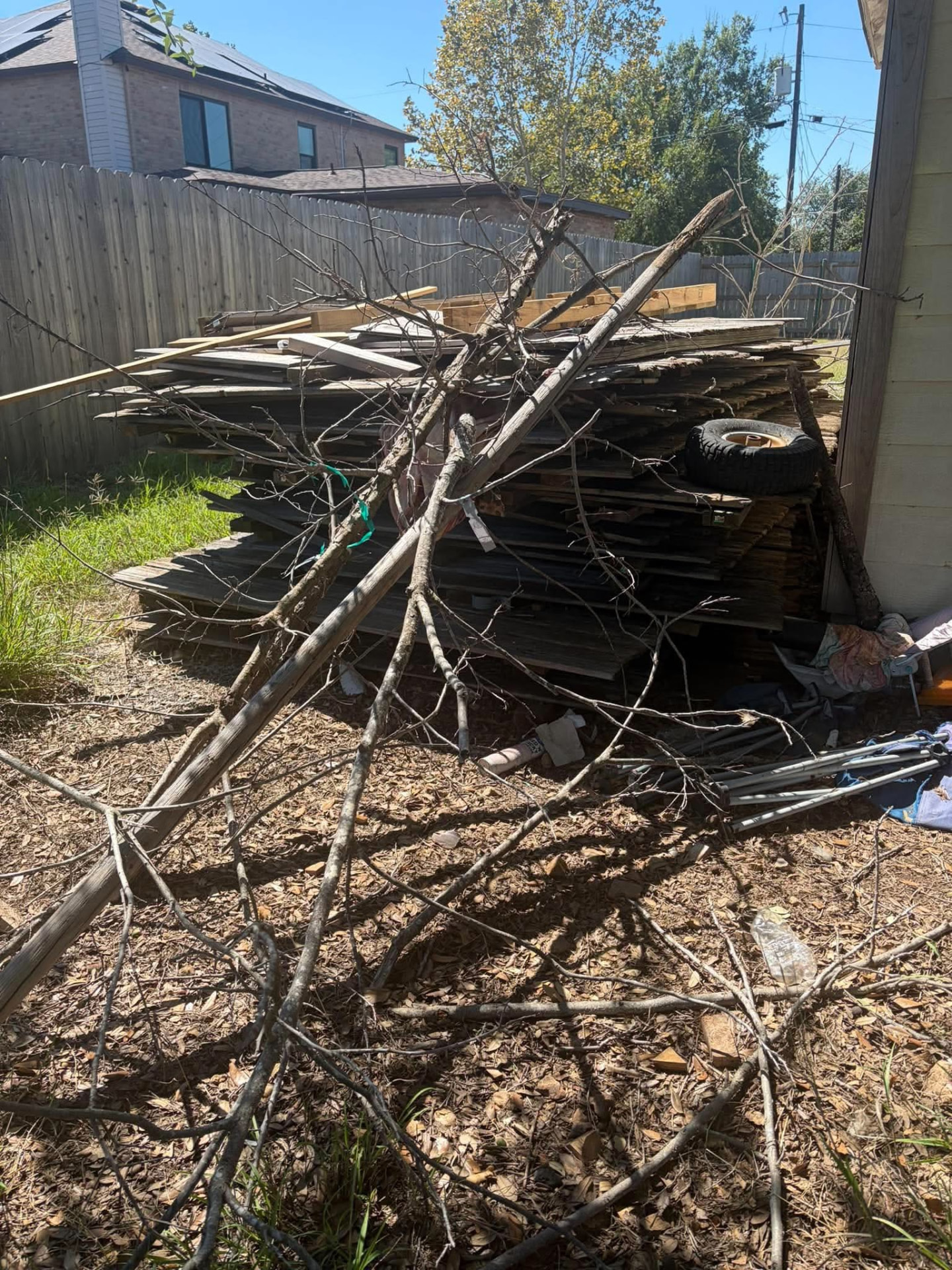 Backyard wood & branch removal before